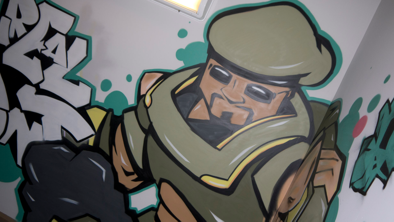 Illustration for article titled Epic Games' History Unfolds in This Graffiti-Covered Stairwell